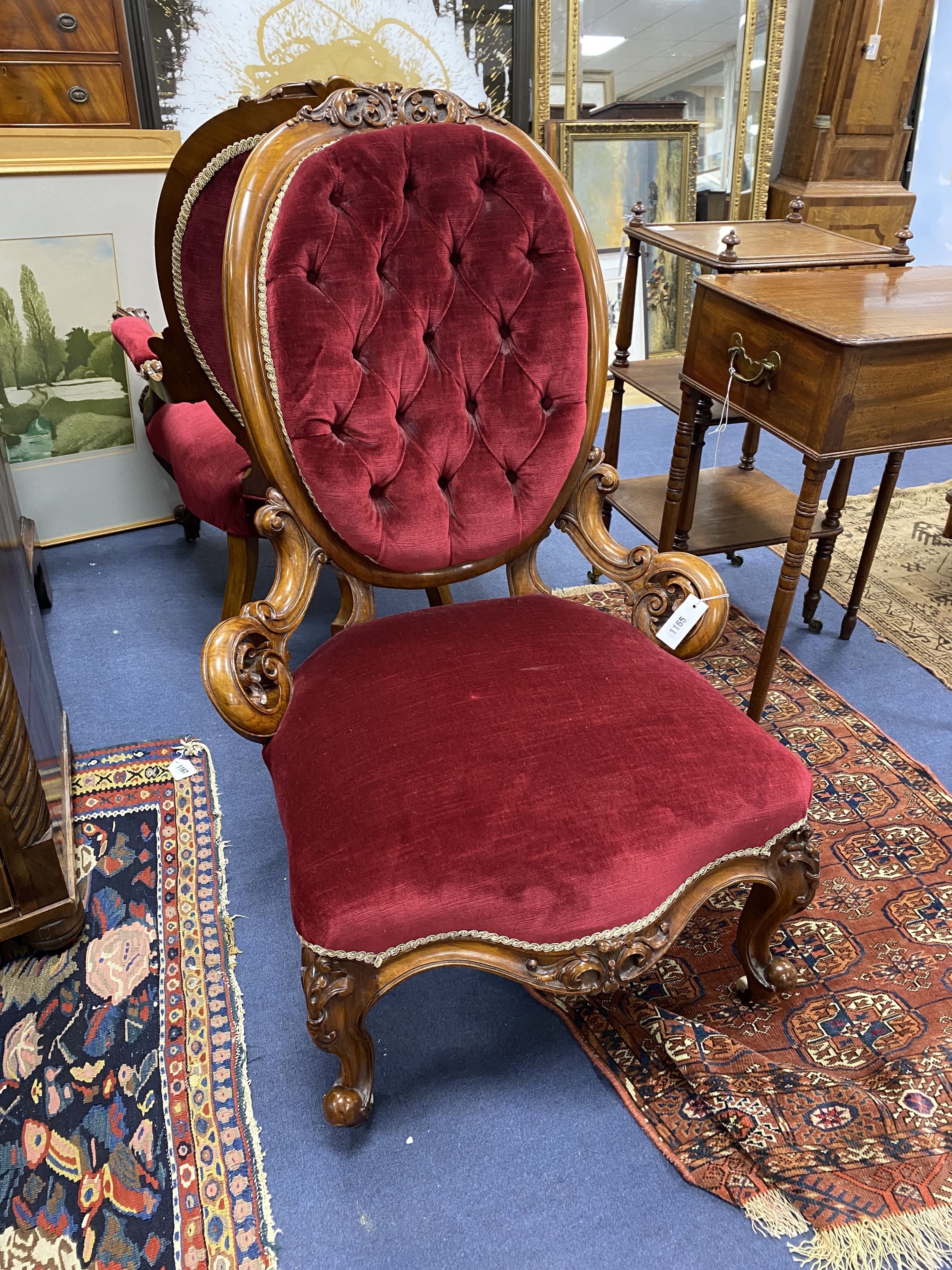 A Victorian carved walnut armchair and matching nursing chair
